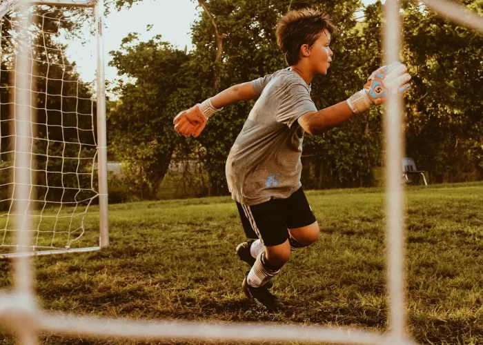 boy playing soccer
